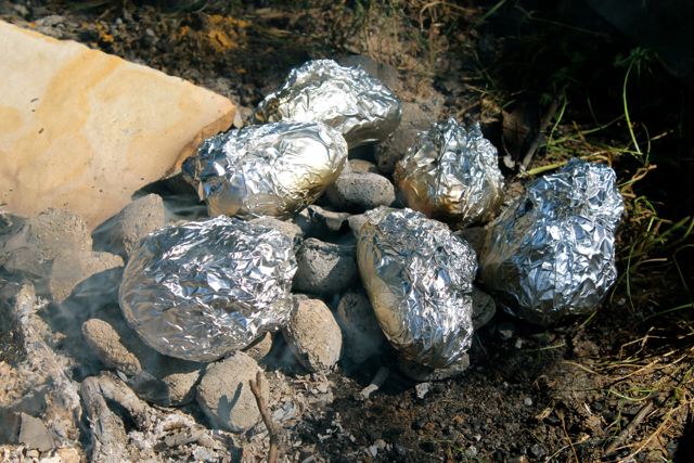 baked potatoes on campfire