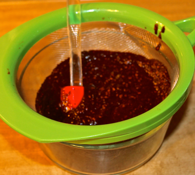 straining chilies